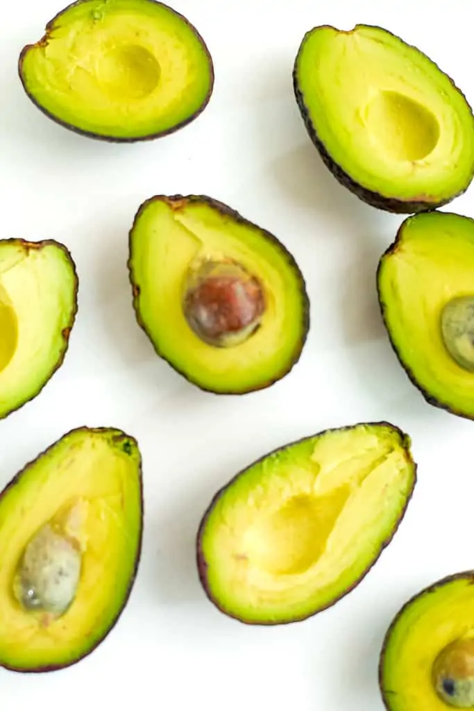 Ripe avocados cut in half.