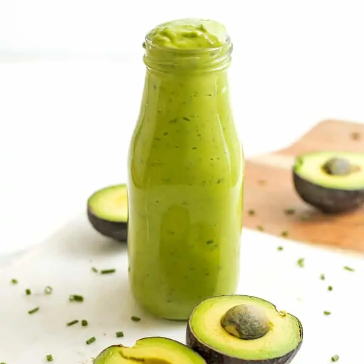 Vegan avocado ranch dressing in a glass bottle.