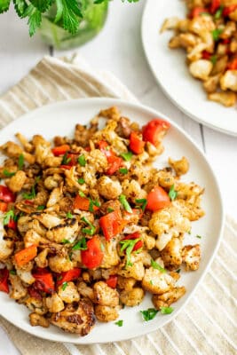 Balsamic roasted cauliflower and peppers on a plate.