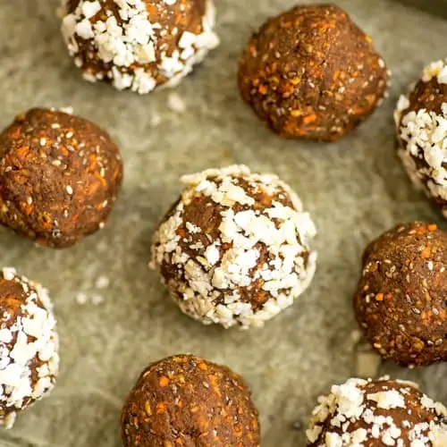 Carrot cake energy bites on a green tray.