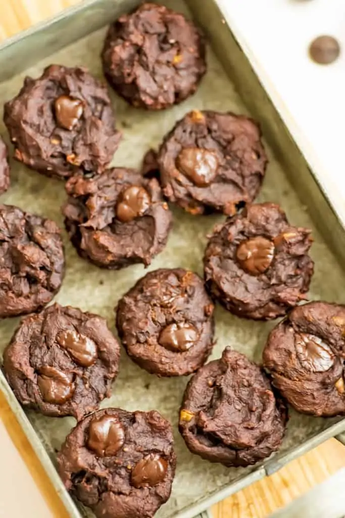 Protein brownie bites in a green tray.