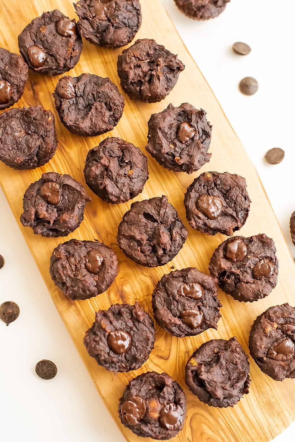 Protein brownie bites on a wood serving tray.