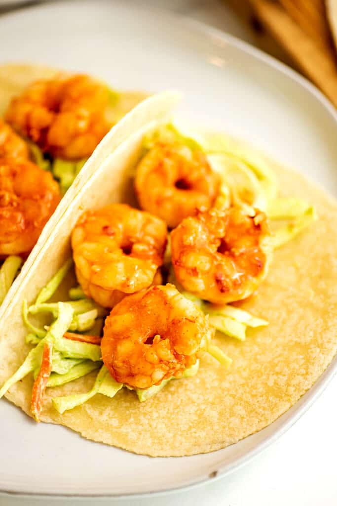 Grilled buffalo shrimp tacos with cilantro lime slaw.