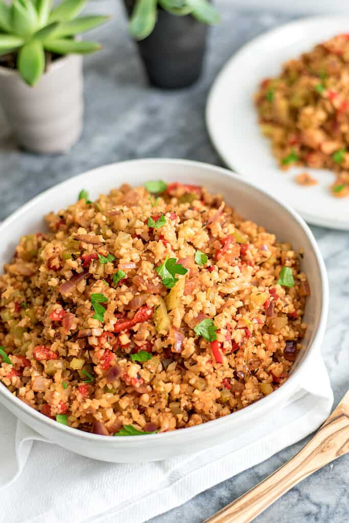 Large bowl filled with dirty cauliflower rice.