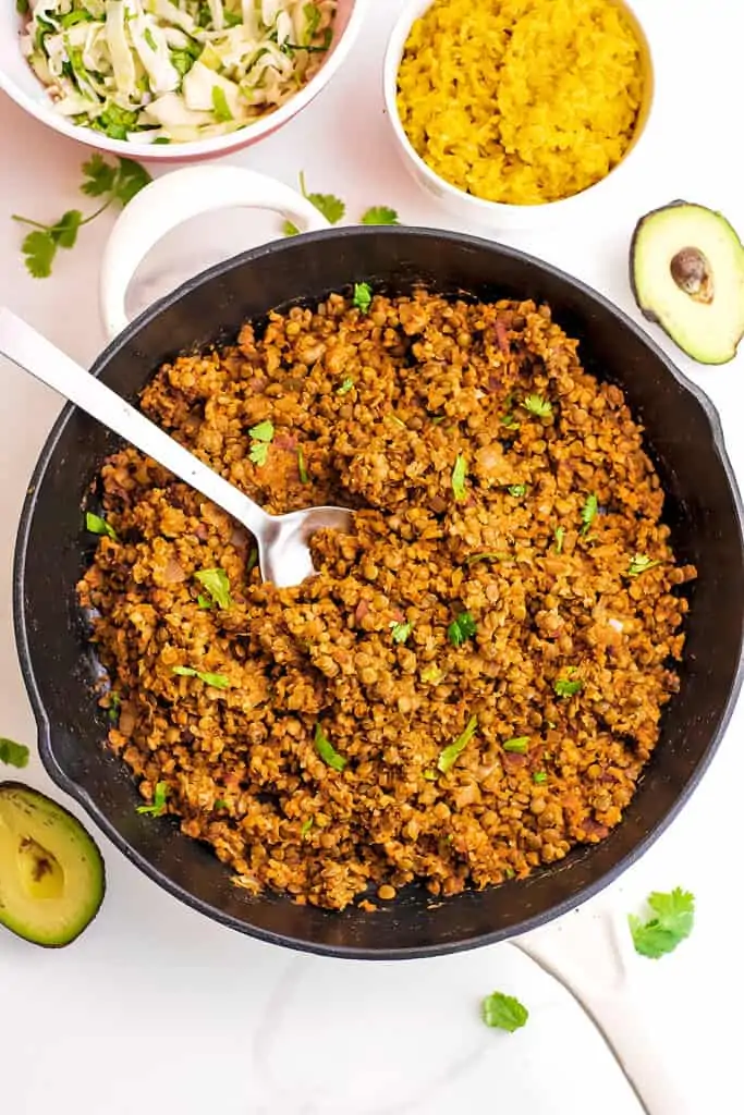 Cauliflower lentil taco meat in a large cast iron skillet.