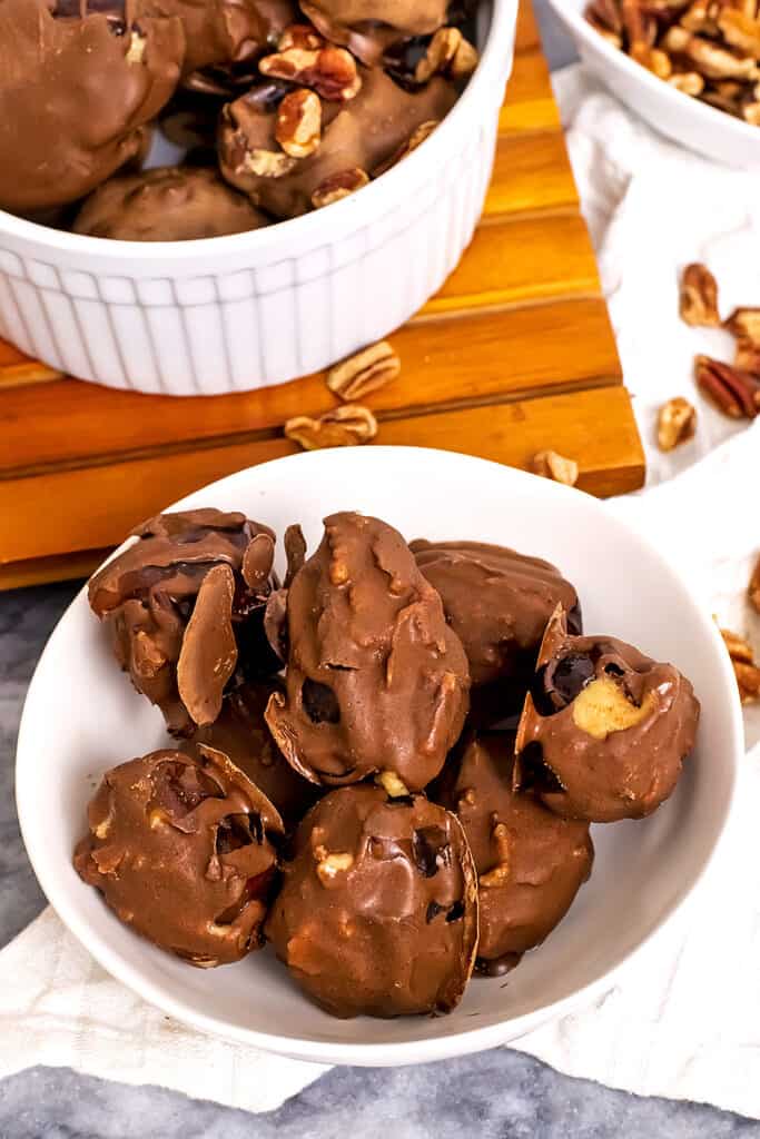 Bowl filled with chocolate peanut butter stuffed dates.