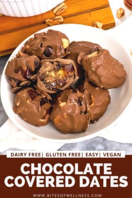 Chocolate covered peanut ubtter stuffeed dates in a white bowl.