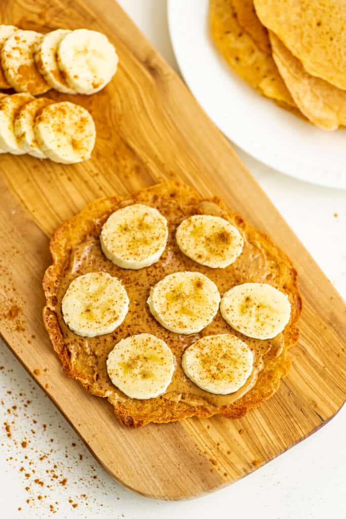 Peanut butter and sliced banana on a lentil flatbread.