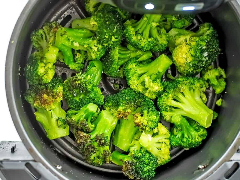 Frozen broccoli after 10 minutes of cooking in air fryer.