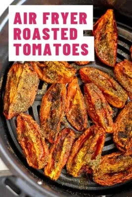 Roasted tomatoes in air fryer basket.