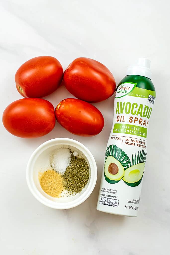 Ingredients to make air fryer tomatoes.