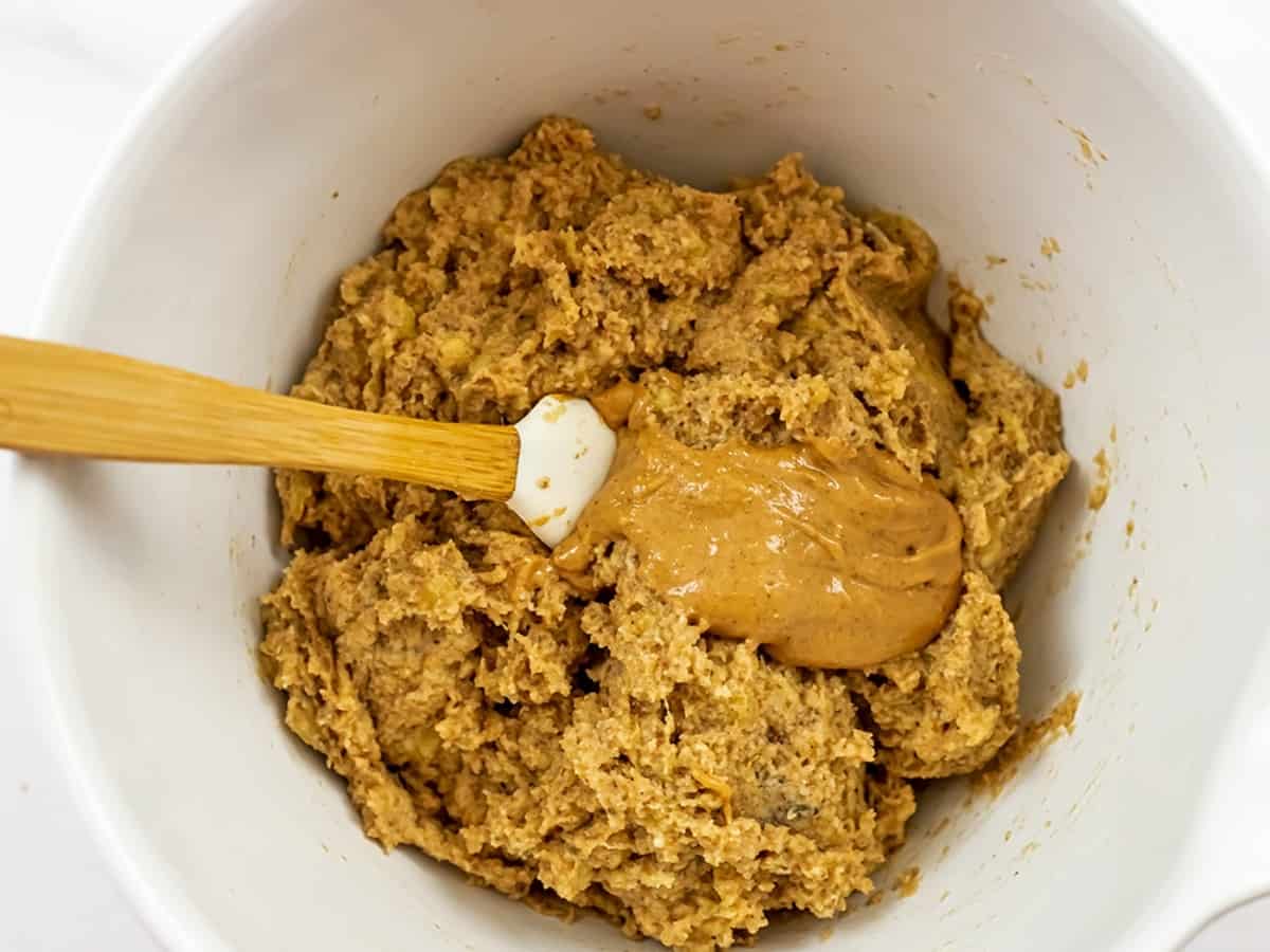Peanut butter being added to the almond flour banana batter.