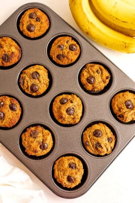 Banana almond flour muffins in a muffin tin.