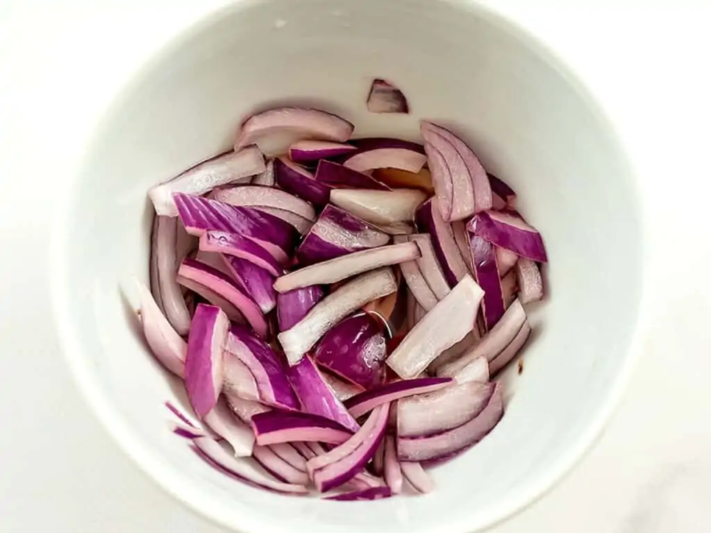 Red onions soaking in red wine vinegar.