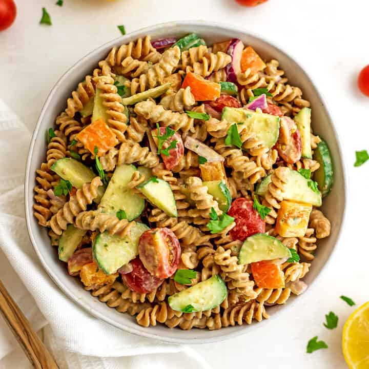 Bowl filled with vegan hummus pasta salad.