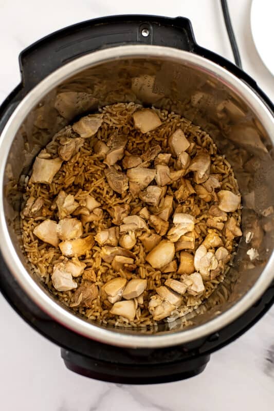 Chicken and fried rice in instant pot after cooking before stirring.