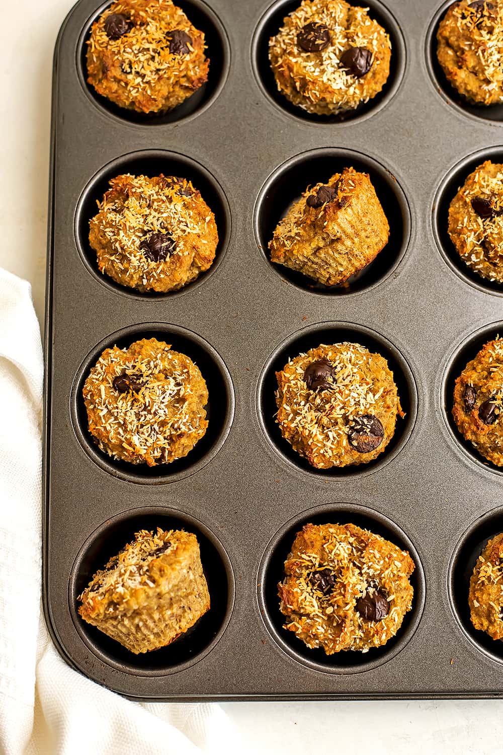 Quinoa banana muffins in a muffin tin after baking.