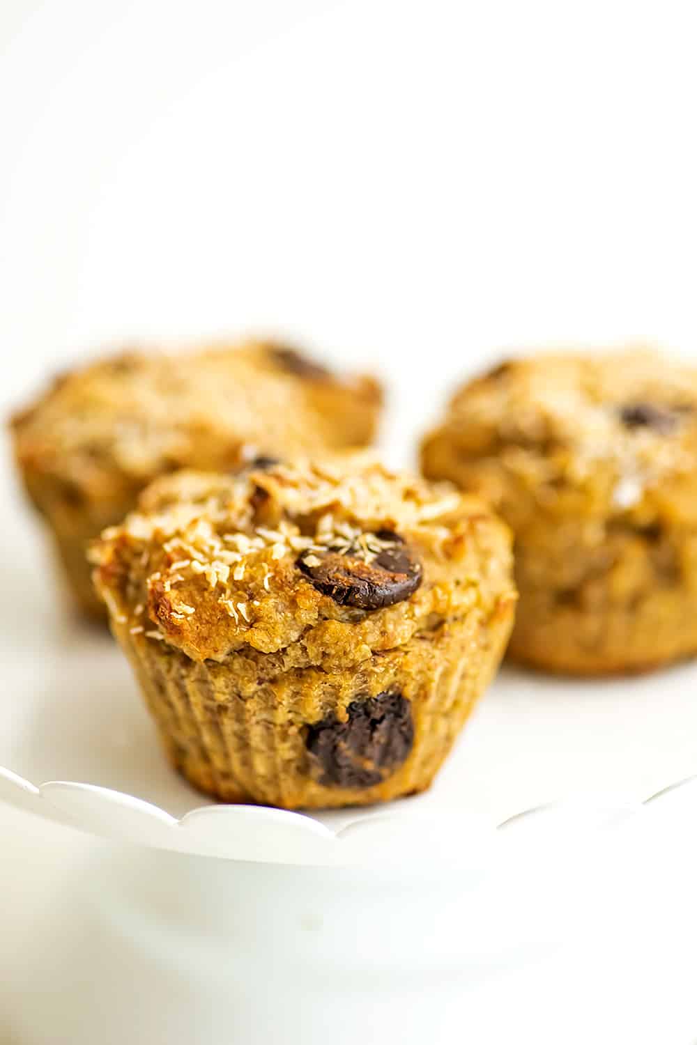 Quinoa banana muffins on a white serving tray.