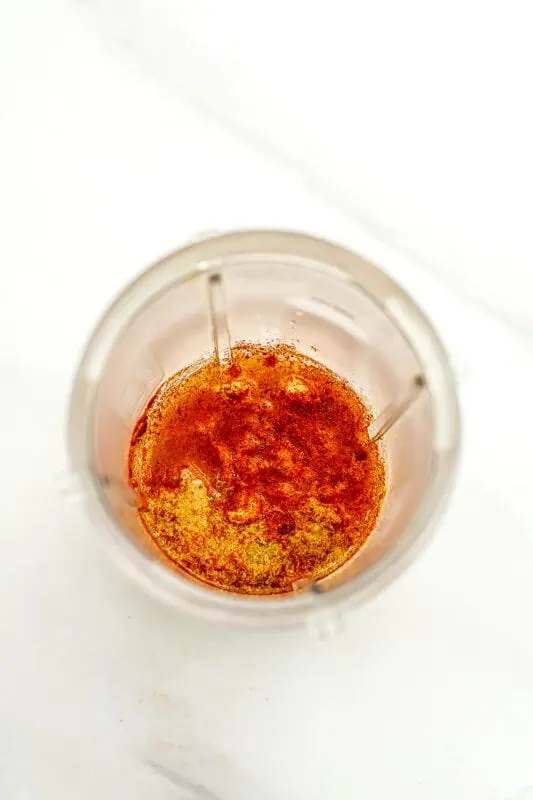 High speed blender with cashews and paprika.