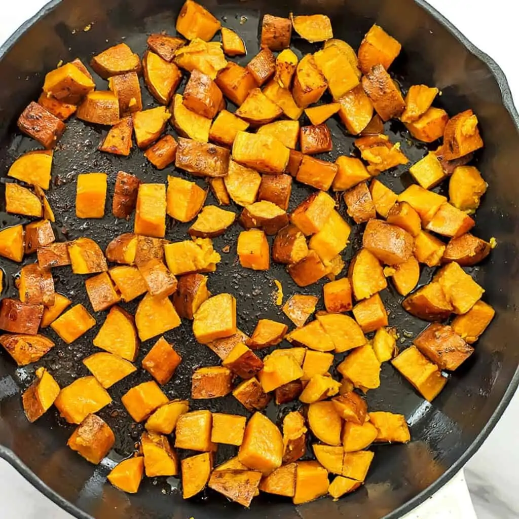 Sweet potatoes in skillet after cooking in oil for 3 minutes.