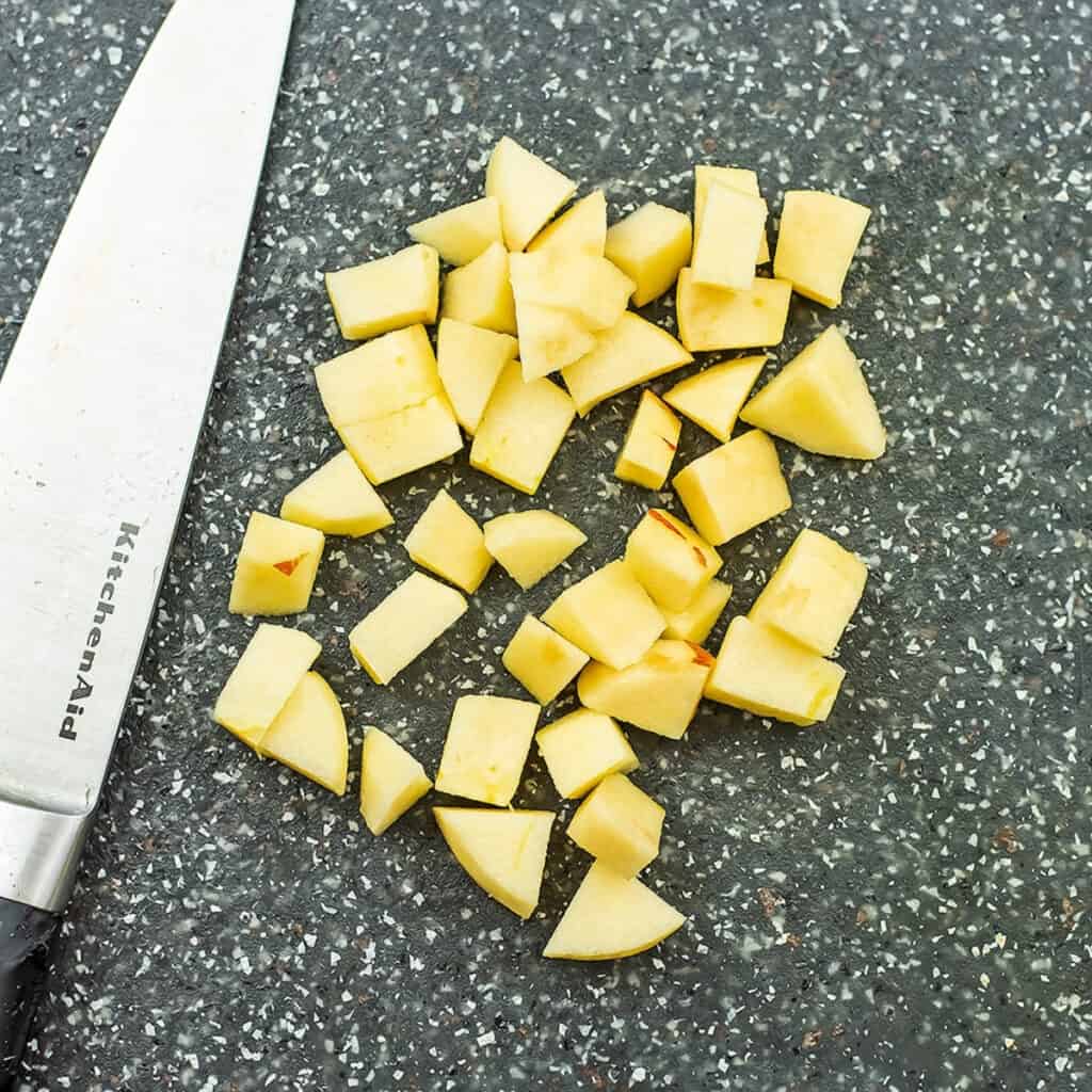 Chopped apples on a cutting board.
