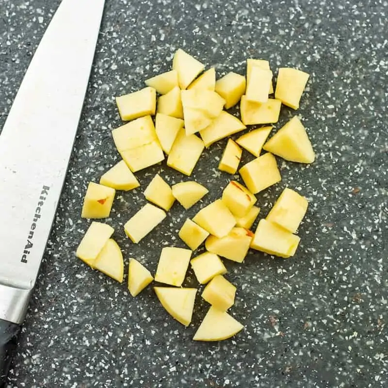 Chopped apples on a cutting board.