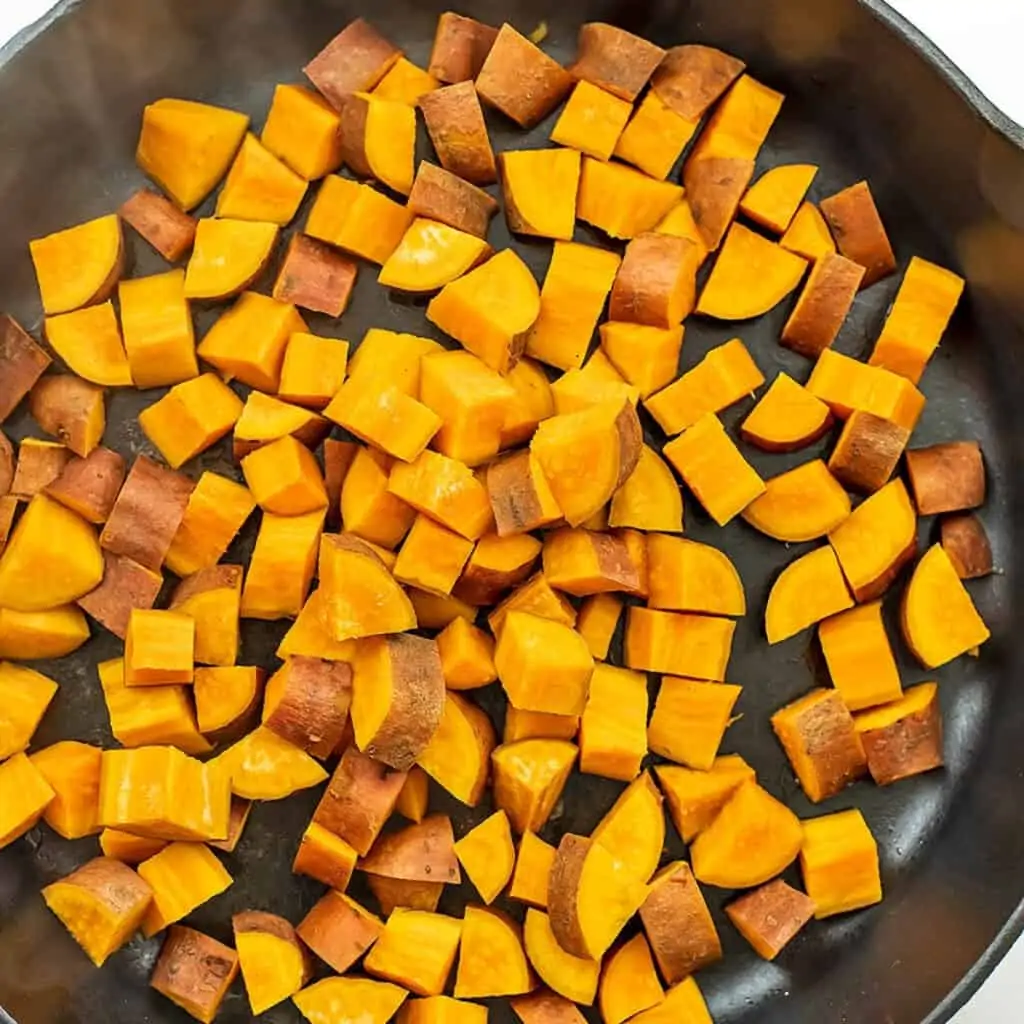 Sweet potatoes in skillet after steaming for 7 minutes.