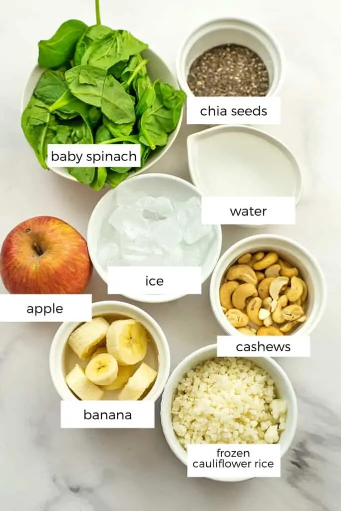 Ingredients to make spinach apple banana smoothie.