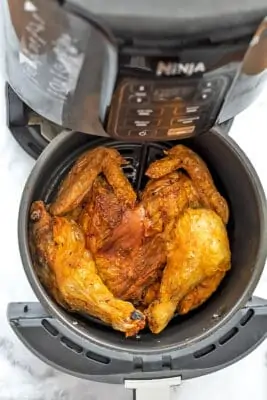 Air fryer spatchcock chicken in air fryer.