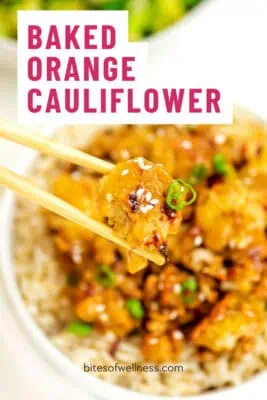 Chopsticks holding baked orange cauliflower