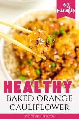 Chopsticks holding baked orange cauliflower