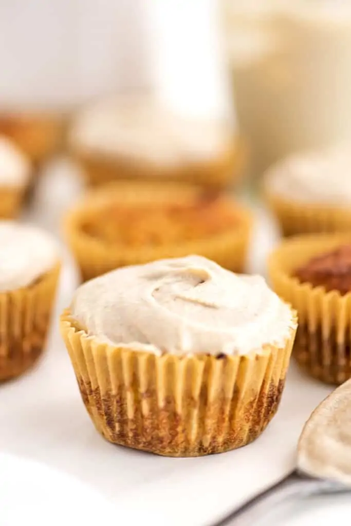 Single cupcake topped with cashew frosting.