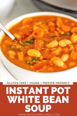 White bowl filled with instant pot white bean soup with spoon.