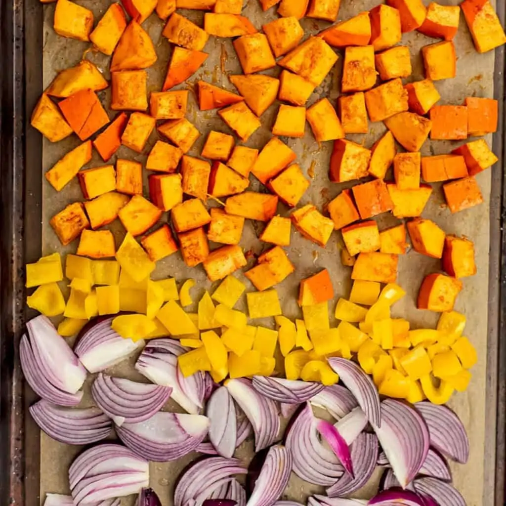 Red onion, bell pepper and pumpkin before roasting.