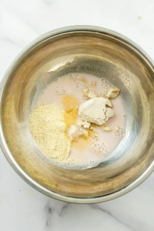 Ingredients to make the breading for cauliflower in large stainless steel bowl.