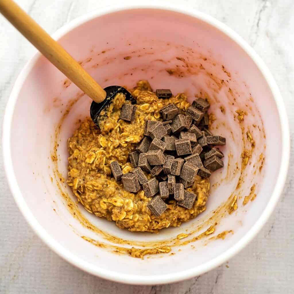 Chocolate chunks in oatmeal batter.