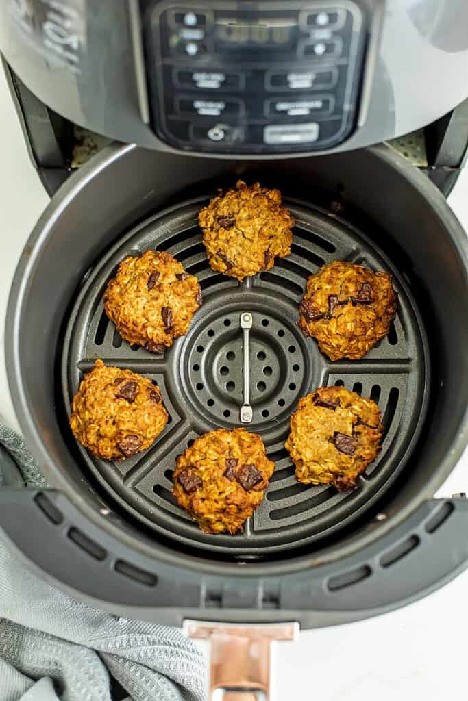 Air fryer filled with chocolate chip oatmeal cookies.