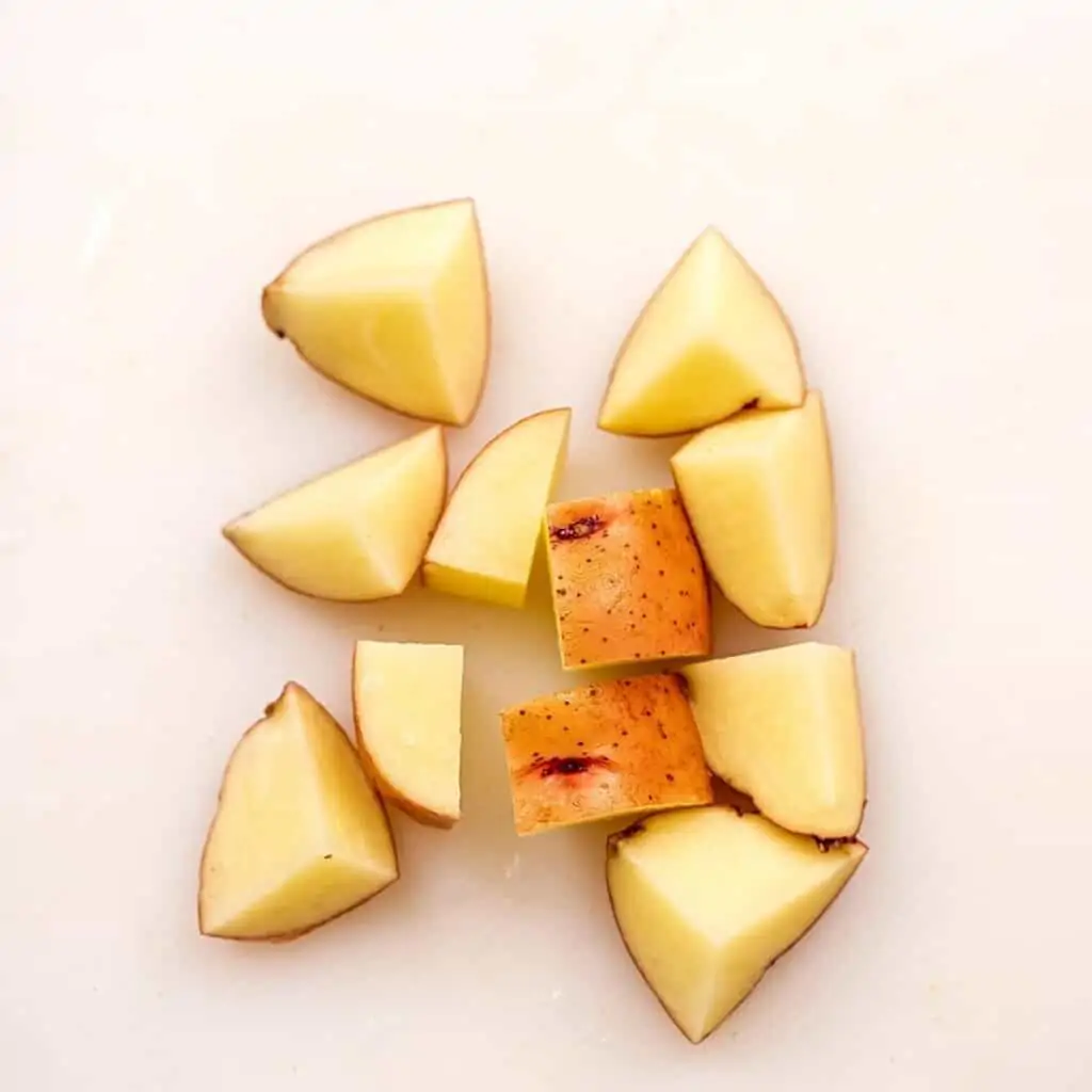 Potatoes cut into 1 inch pieces for cooking.
