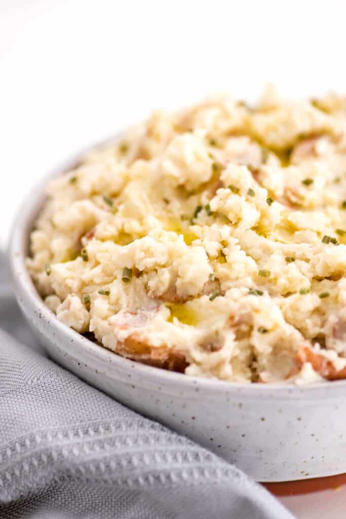 Creamy dairy free mashed potatoes in a grey bowl.