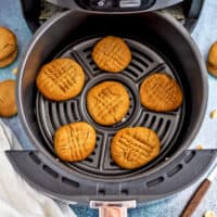 Peanut butter cookies in the air fryer basket.