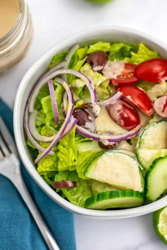 Salad topped with creamy tahini lime dressing.