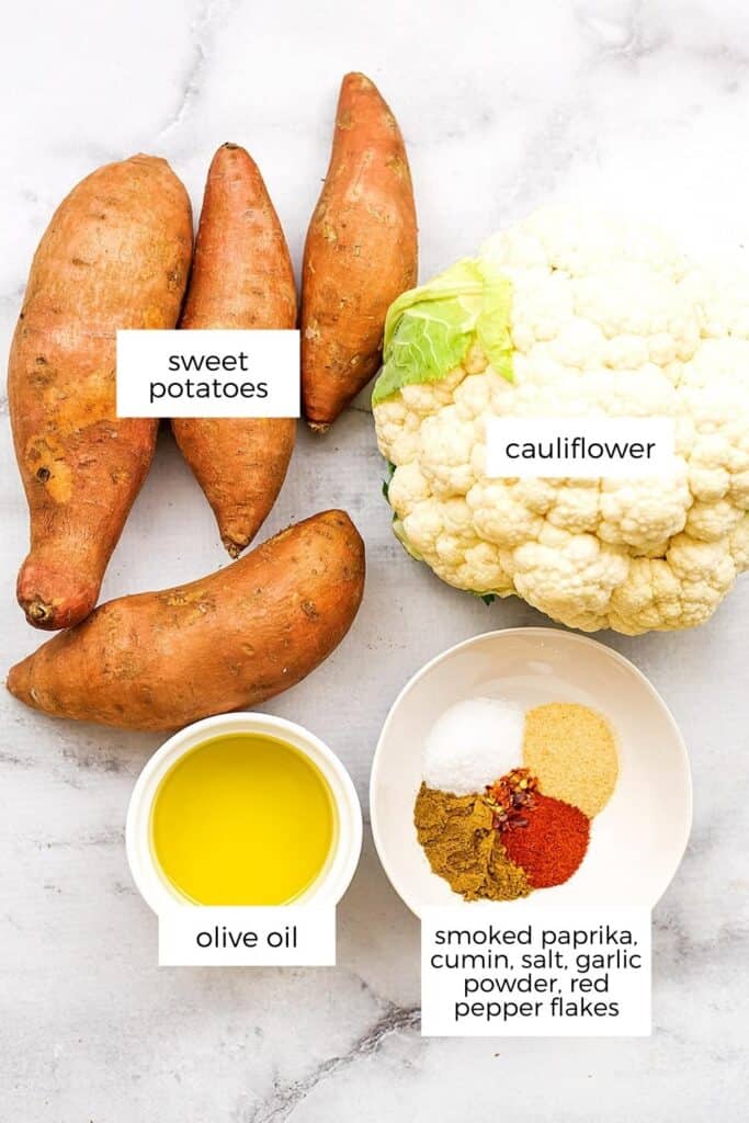 Ingredients to make roasted cauliflower and sweet potatoes.