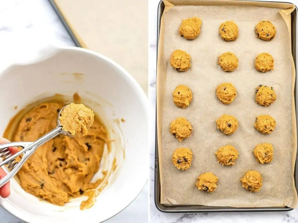 Cookie scoop scooping batter from bowl to parchment paper lined baking sheet.