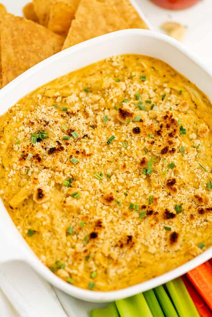 Casserole dish filled with healthy buffalo chicken dip.