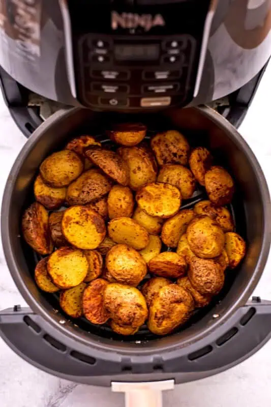 Baby potatoes in air fryer after cooking.