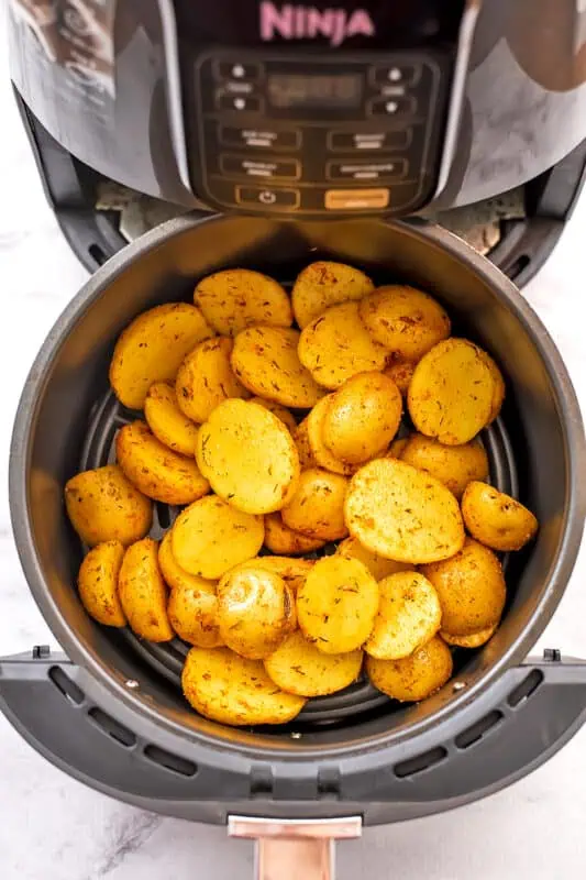 Mini potatoes in air fryer before cooking.