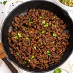 Mexican black beans for tacos in cast iron skillet.