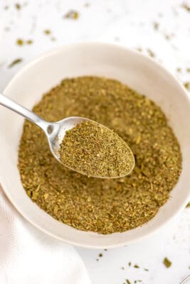 Substitute for italian seasoning in a bowl with a spoon.