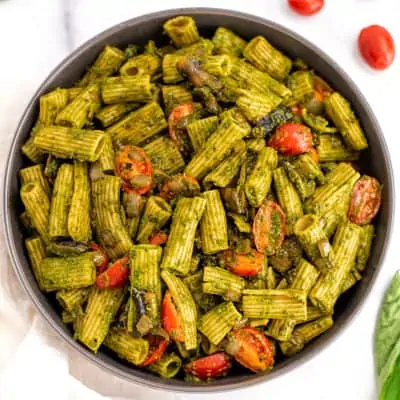 Skillet with pesto mushroom mpasta.