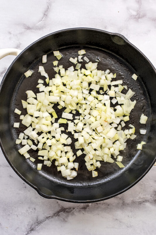Chopped onion and garlic in a skillet.